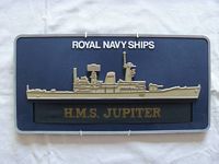 WALL PLAQUE AND CAP TALLY FROM THE ROYAL NAVAL VESSEL HMS JUPITER