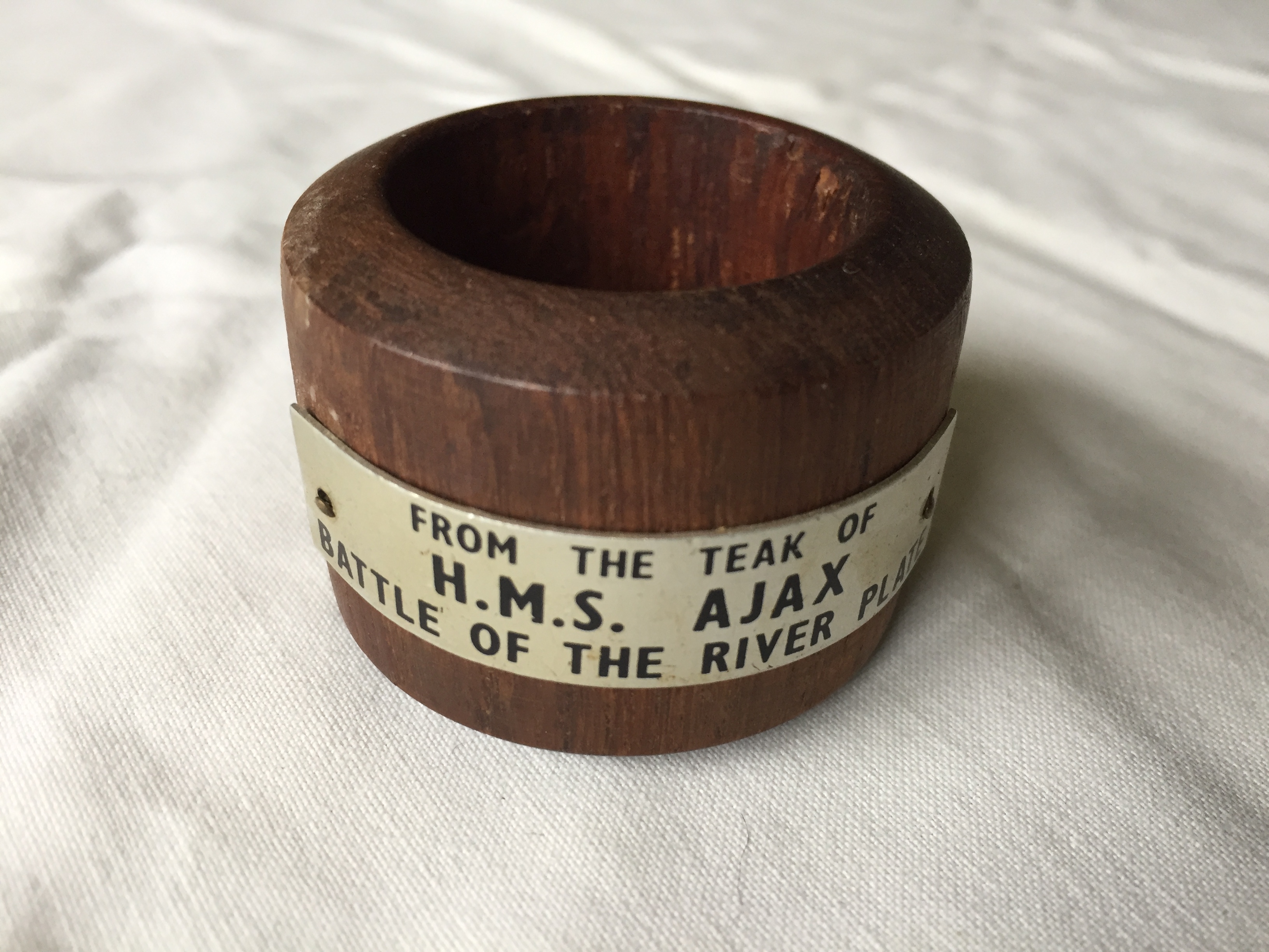 WOODEN NAPKIN RING FROM THE ROYAL NAVAL VESSEL HMS AJAX 
