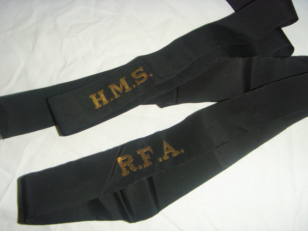 PAIR OF SERVICE CAP TALLY'S SHOWING ON THEM HMS & RFA