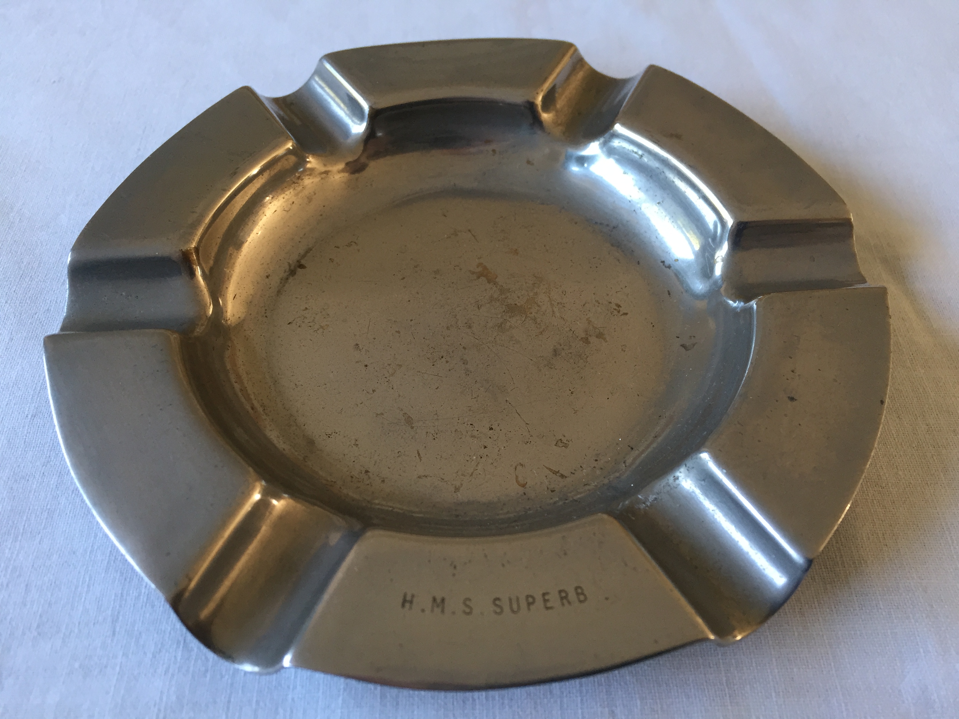 SILVER COLOURED ASHTRAY FROM THE NAVAL VESSEL THE HMS SUPERB