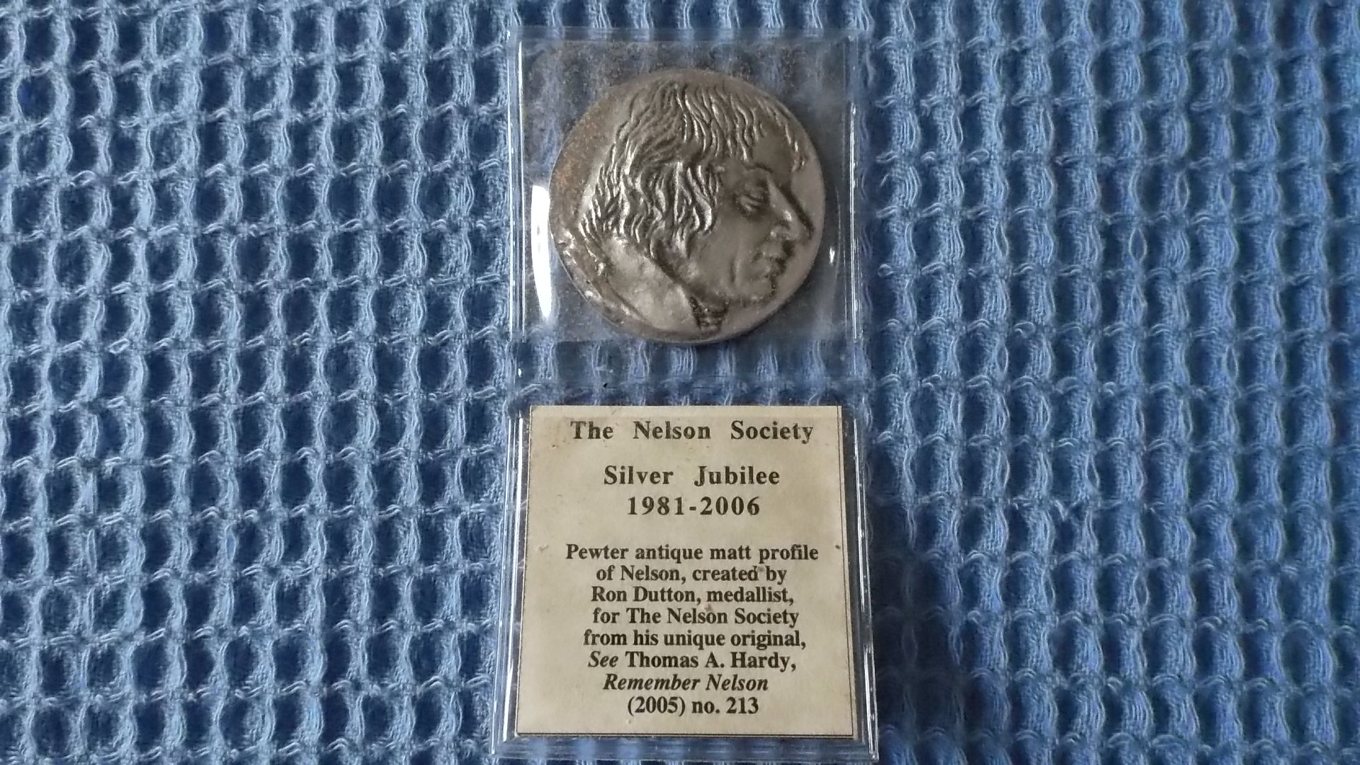 SOUVENIR NELSON SOCIETY SILVER JUBILEE COIN IN ORIGINAL PACKAGING 