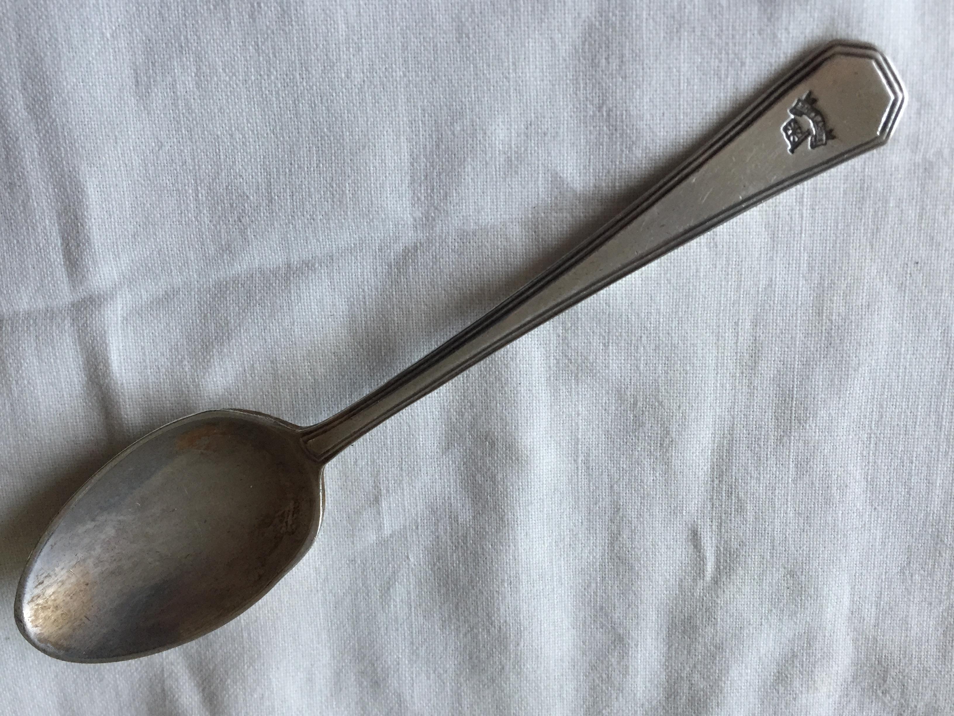 AS USED IN SERVICE TEA SPOON FROM THE PORT LINE 